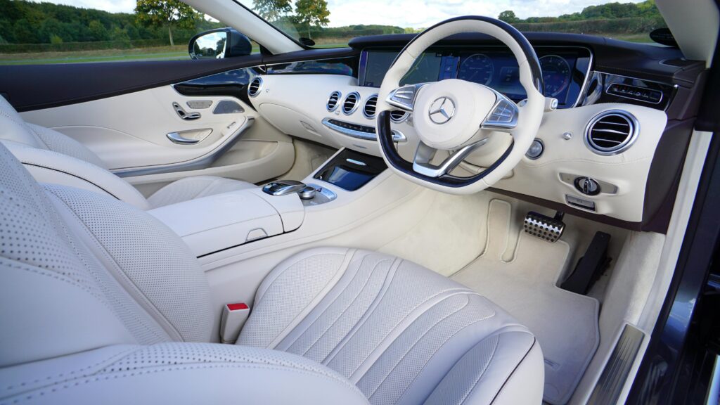 Explore the luxurious interior design of a white Mercedes car showcasing modern automotive elegance.